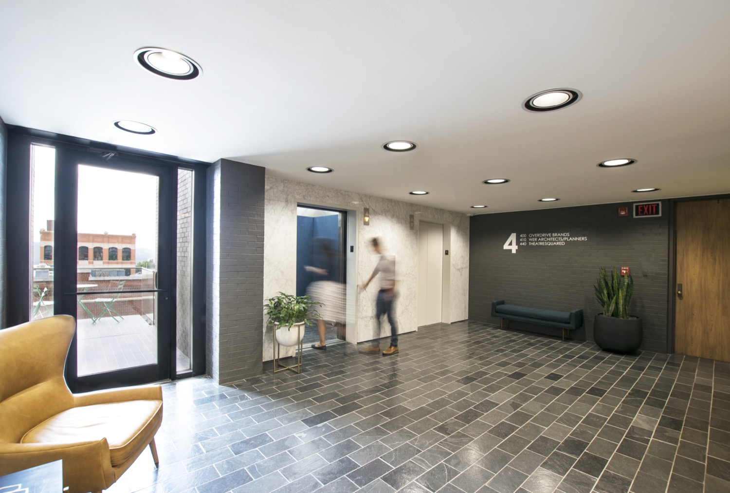 Fourth-Floor-Lobby-with-slate-floors-and-elevator