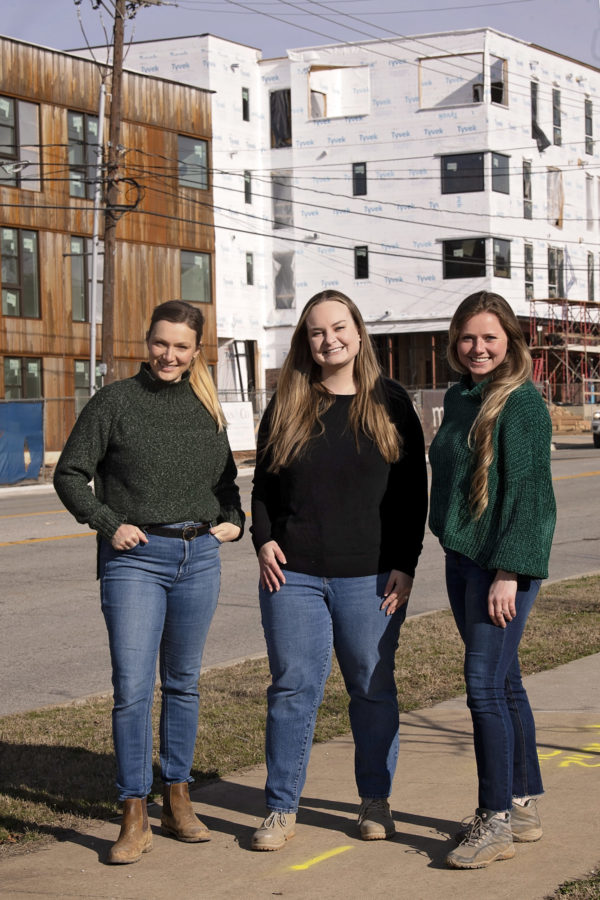 Project Manager Kaitlyn Fondano, Operations Manager Paige Sauerwein, and Project Architect Kiara Luers at the construction site of South Yard in Fayetteville
